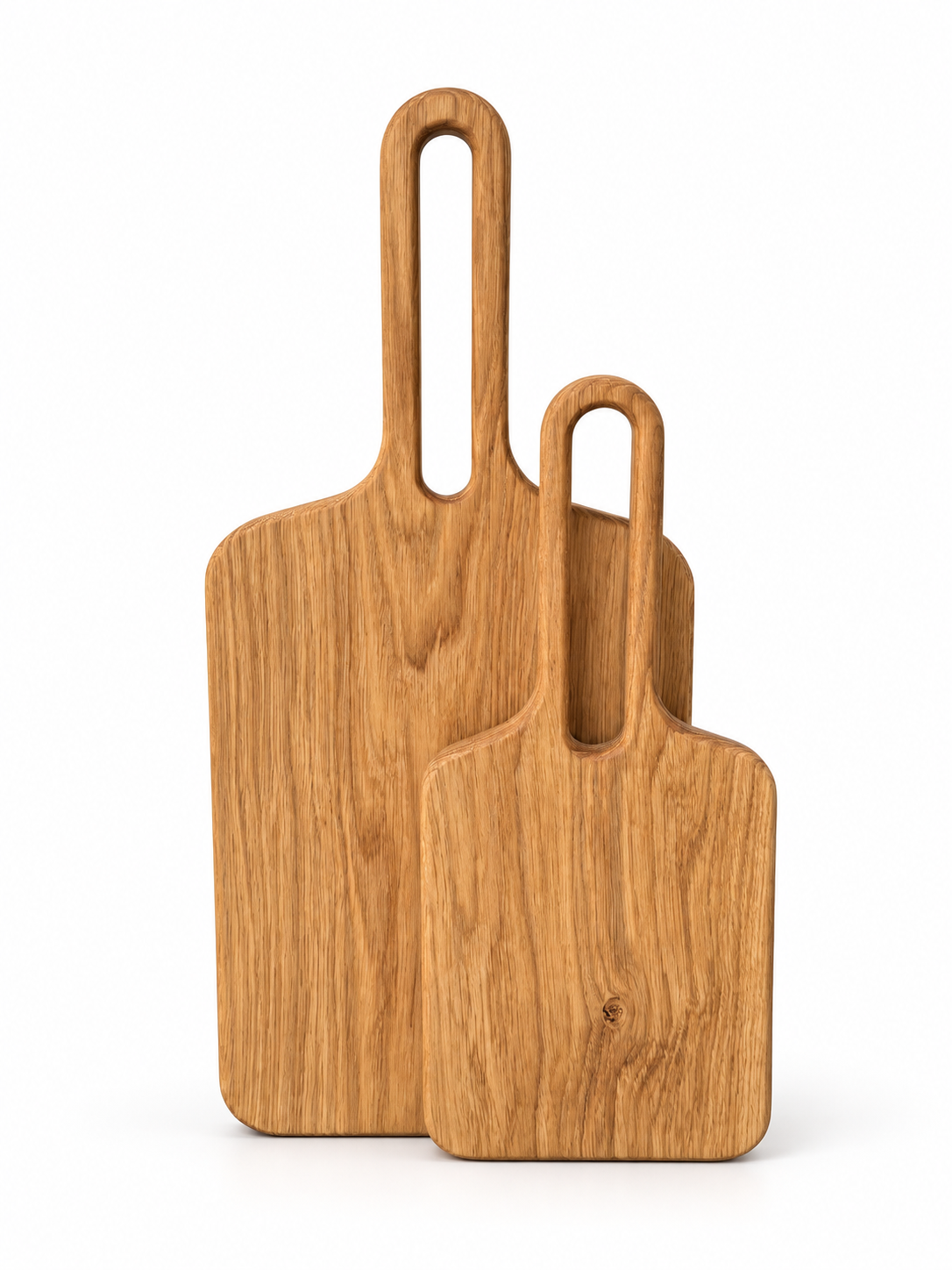 Small and large oak serving boards on a white background