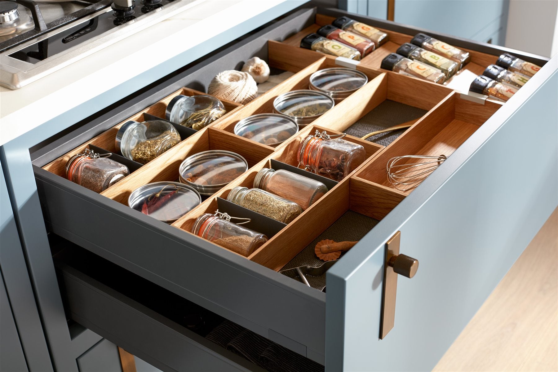 Interior inspiration: wooden drawer dividers organising kitchen utensils and spices