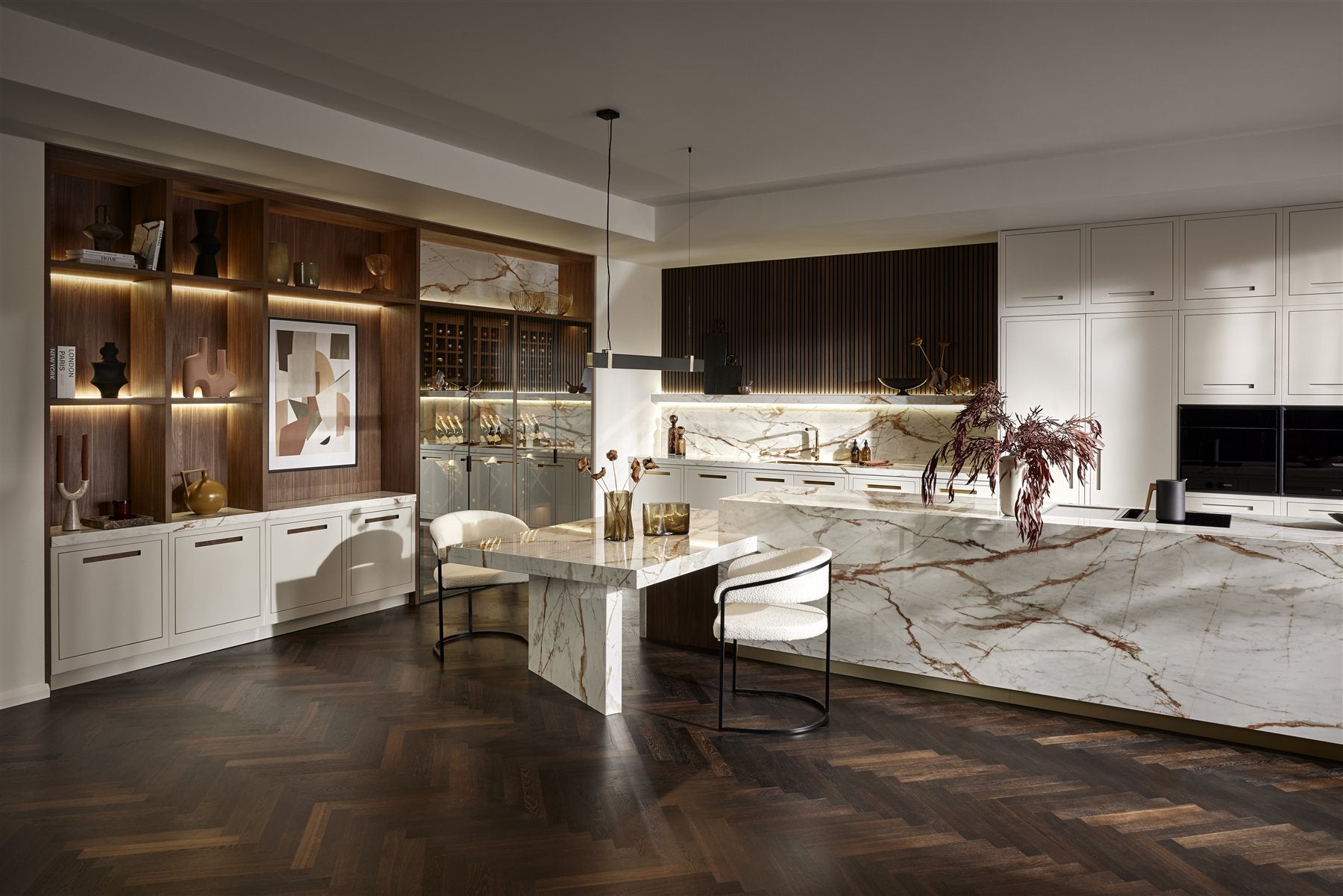 Interior inspiration: a kitchen with pale cabinetry, timber shelving and a large island