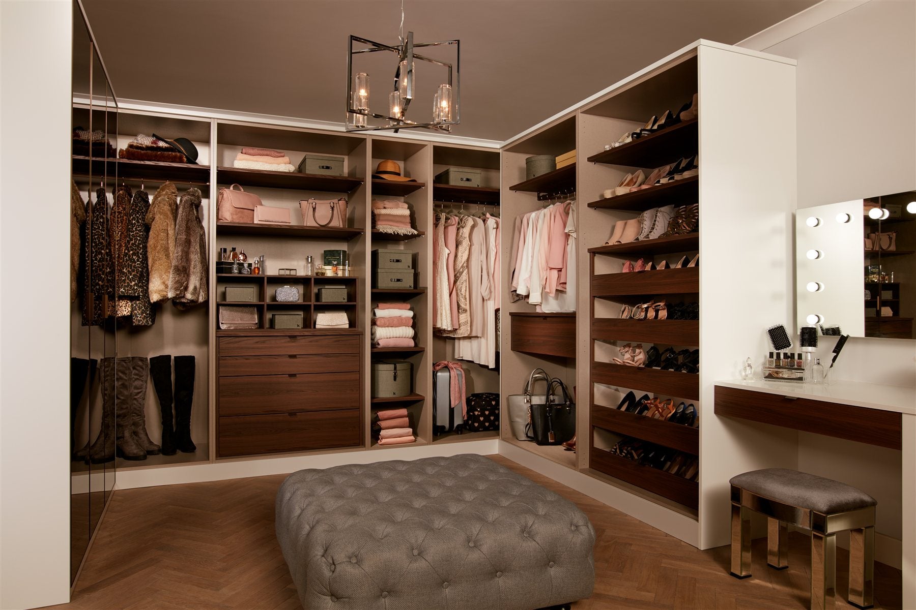 Interior inspiration: a walk-in wardrobe with open shelving and dark wood drawers